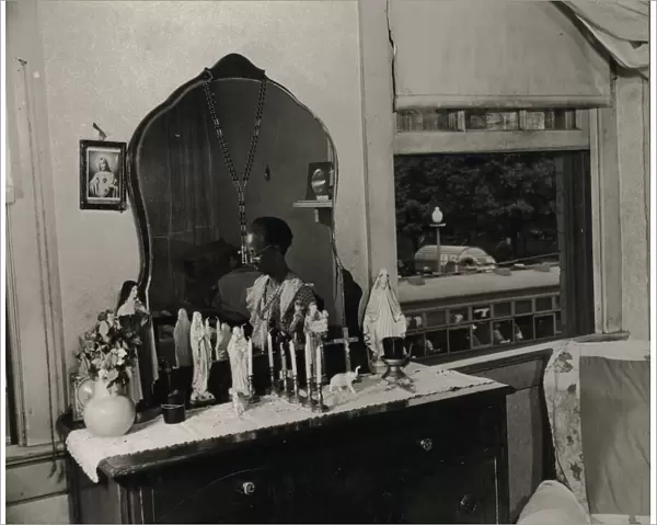 Dresser in the bedroom of Mrs. Ella Watson, a government charwoman, Washington, D. C. 1942. Creator: Gordon Parks