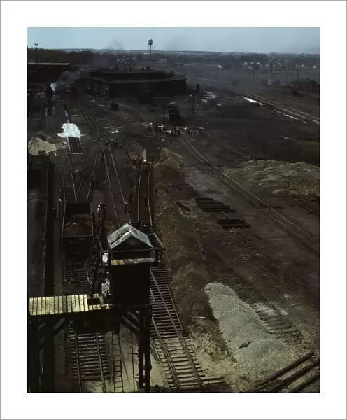 Track repair work at the Bensenville yard of the Chicago, Milwaukee... Illinois, 1943. Creator: Jack Delano