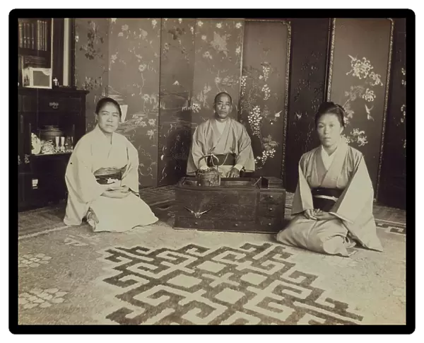 Japanese servants O Hero San, O Eun San, and O Sok San with tea utensils in the... 1899. Creator: Eleanor Lord Pray