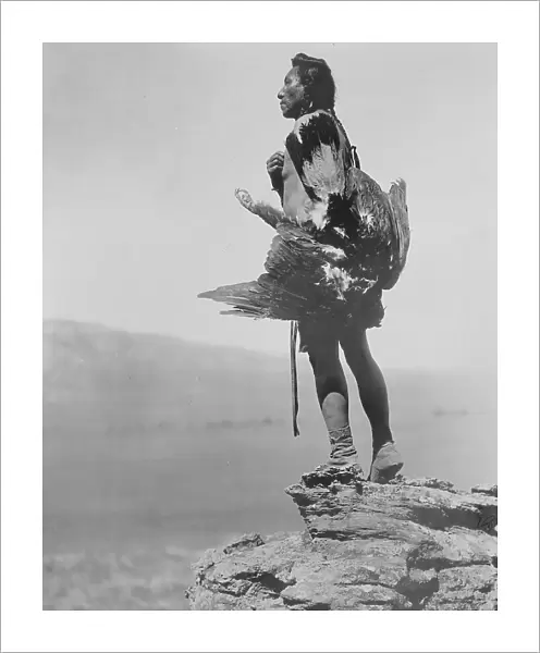 The eagle catcher, c1908. Creator: Edward Sheriff Curtis