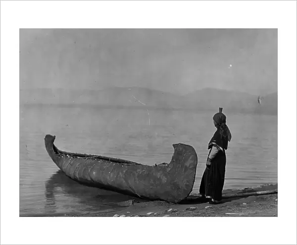 On the shore of the lake-Kutenai, c1910. Creator: Edward Sheriff Curtis
