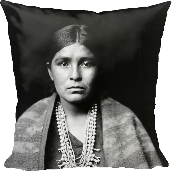 Head-and-shoulders portrait of Navajo woman, facing front, c1904. Creator: Edward Sheriff Curtis