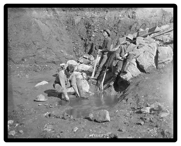Men panning gold, between c1900 and 1927. Creator: Lomen Brothers