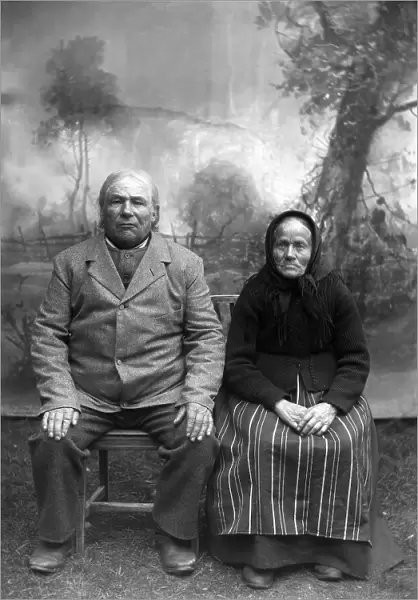 Homeowner and church steward Näs Jonas Jonsson (1825-1908) with his wife... 1900-1908. Creator: Per Persson