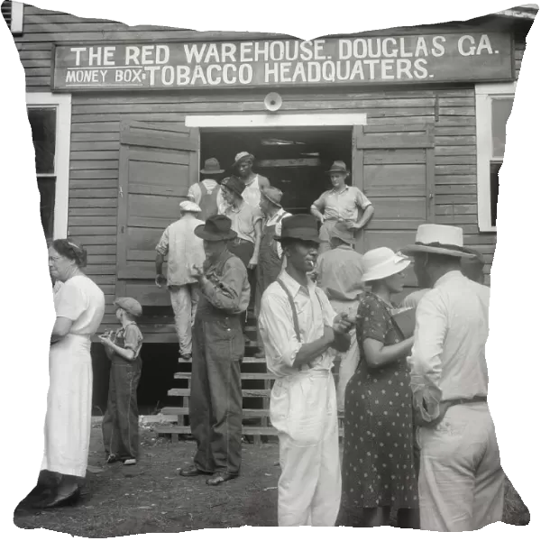 As the auctioneer knocks down the last bid on each basket of tobacco... Douglas, Georgia, 1938. Creator: Dorothea Lange