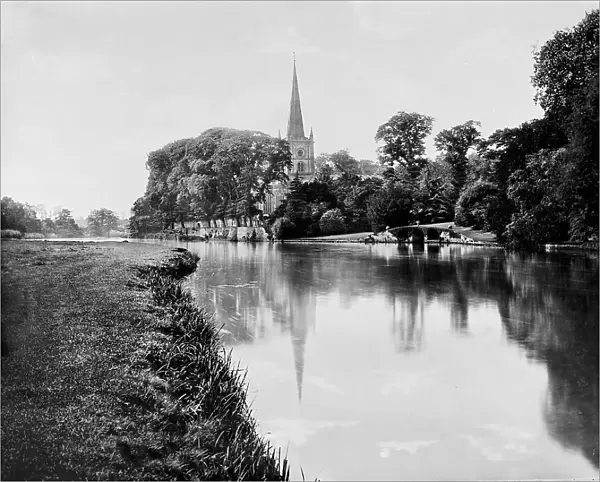 Trinity Church by river, Stratford-on-Avon, between 1900 and 1910. Creator: William H. Jackson