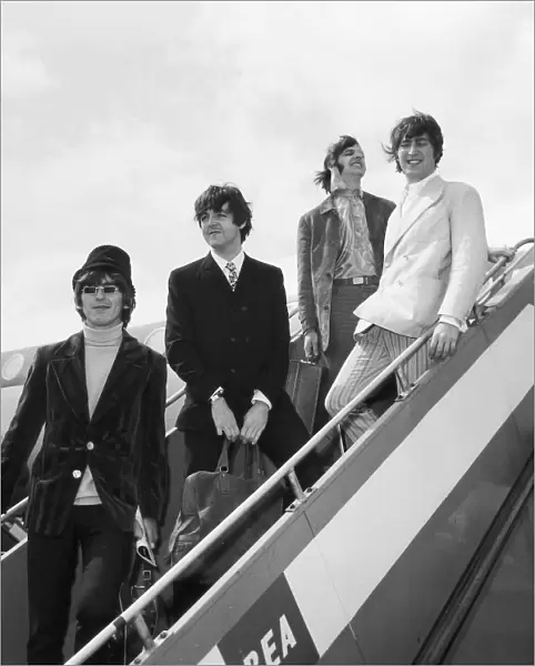 The Beatles at London Airport to fly out to Germany for a brief