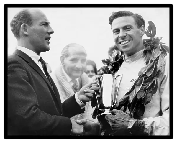 Jim Clark accepts the trophy from Sir Stirling Moss 1962