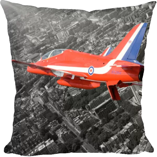 A Hawk T1A from the Red Arrows roars over London during a flypast for the Queen s