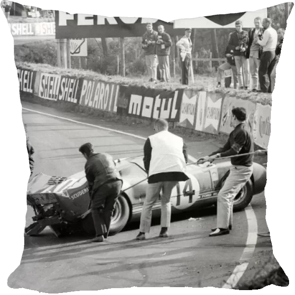 Le Mans 24 Hour Race: The Scuderia Filipinetti Ford GT40 of Peter Sutcliffe and Dieter Spoerry is removed from the circuit after crashing out