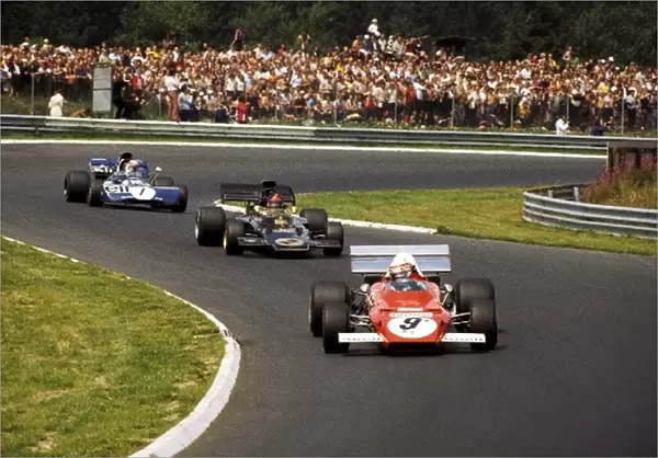 Formula One World Championship: Second placed Clay Regazzoni Ferrari 312B2 leads Emerson Fittipaldi Lotus 72D and Jackie Stewart Tyrrell 003