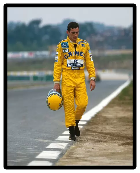 Formula One World Championship: Ayrton Senna Lotus 99T walks back to the after a practice spin