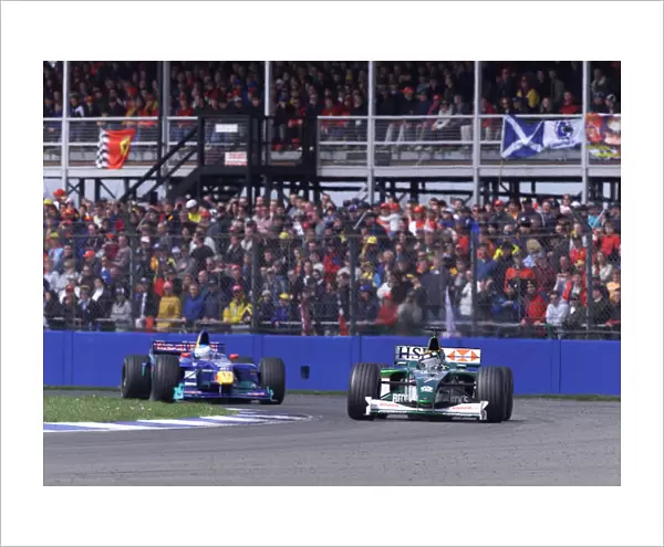 Eddie Irvine leads Mika Salo