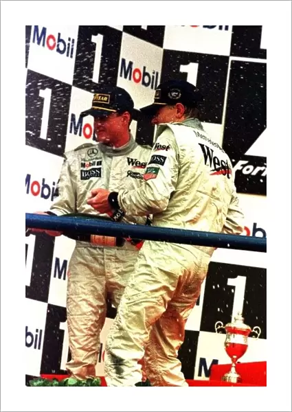 1997 EUROPEAN GP. Mika Hakkinen and David Coulthard celebrate a McLaren 1-2 in Jerez