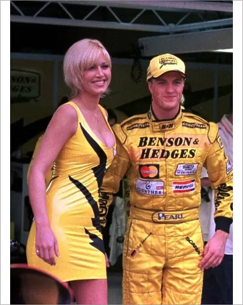 1998 ARGENTINIAN GP. Ralf Schumacher stands timidly next to model Emma Noble