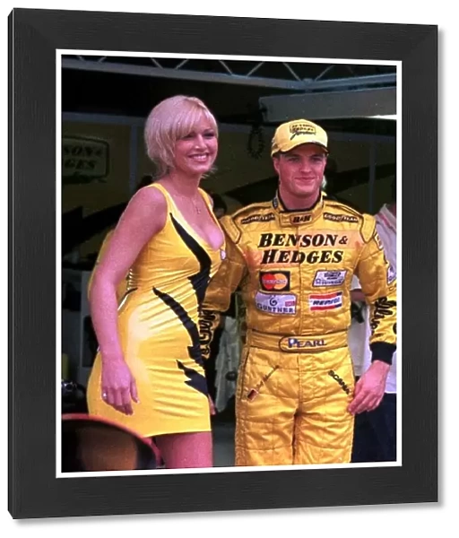 1998 ARGENTINIAN GP. Ralf Schumacher stands timidly next to model Emma Noble