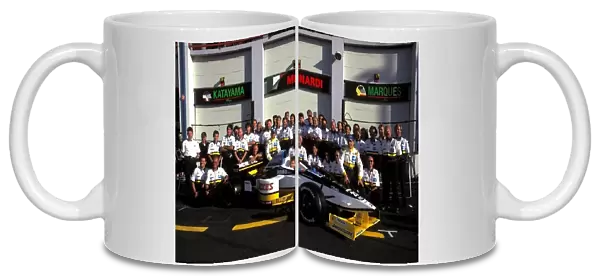 Formula One World Championship: The Minardi Team pose for their group photo with the Minardi M197