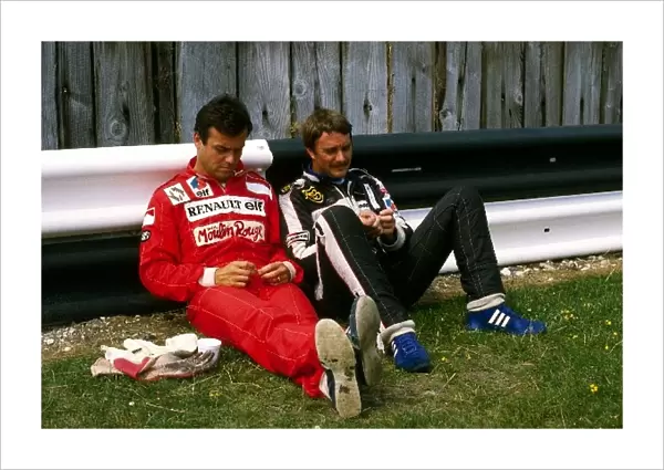 Formula One World Championship: Patrick Tambay Renault with Nigel Mansell Lotus before the start of the race