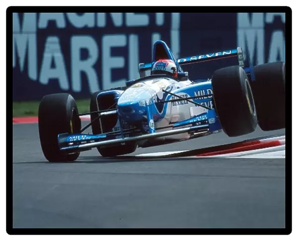 Formula One World Championship: Johnny Herbert Benetton B195 jumps the curbs on the way to 1st place