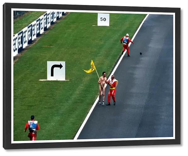 Formula One World Championship: A streaker runs down the pit straight at Silverstone
