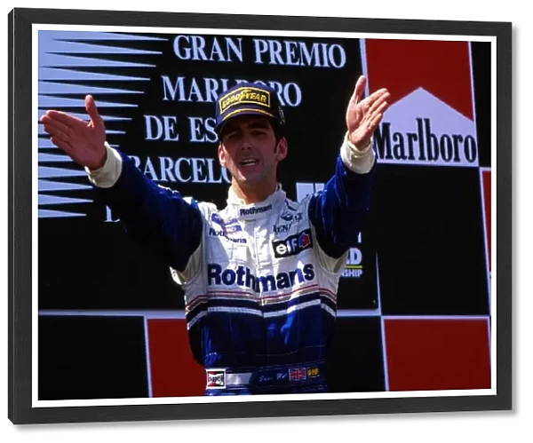 Formula One World Championship: Damon Hill celebrates an emotional victory for himself and the Williams team following the tragic events of recent