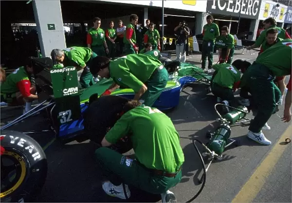Formula One World Championship: The 7-Up Jordan team practice pitstops before the team makes its Grand Prix Debut