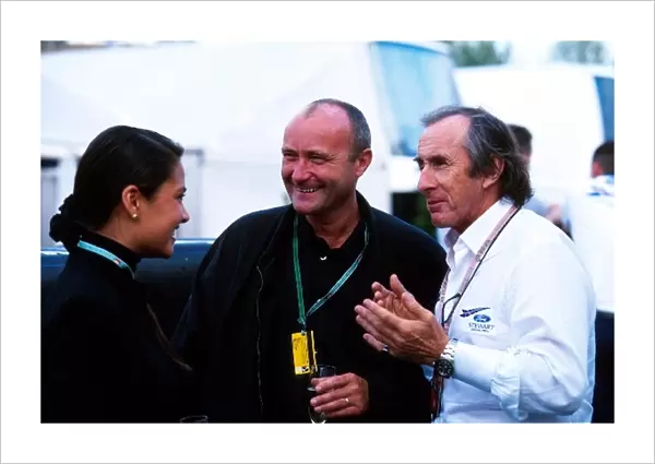 Formula One World Championship: Rock star Phil Collins with Jackie Stewart