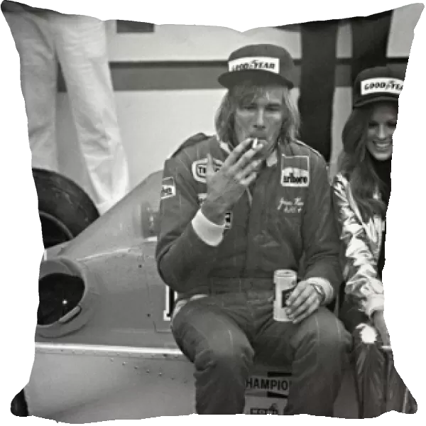 Formula One World Championship: Winner James Hunt Mclaren M26, with victory spoils, cigarette, beer, girl and garland
