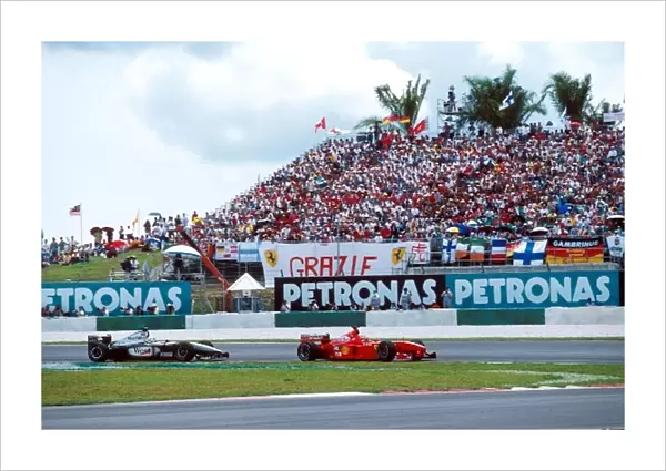 Formula One World Championship: Winner Eddie Irvine Ferrari F399 leads Coulthard
