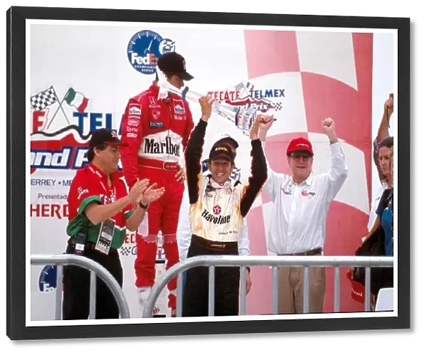FEDEX Champ Car Championship: Winner Cristiano Sa Matta, centre, holds his trophy high with team boss Carl Hs, right, and 2nd place Gil de Ferran