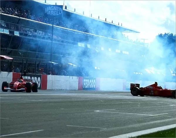 Formula One World Championship: Luca Badoer Ferrari F2001 takes avoiding action as Rubens Barichello spins his Ferrari F2001 for the crowd
