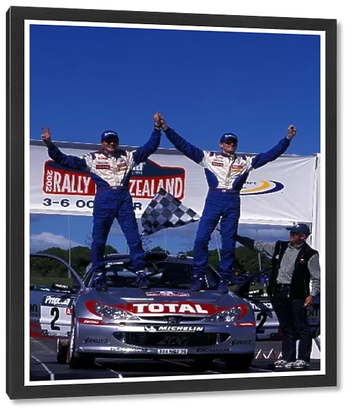 World Rally Championship: 2002 World Rally Champion Marcus Gronholm and co-driver Timo Rautianen celebrate their rally and championship success