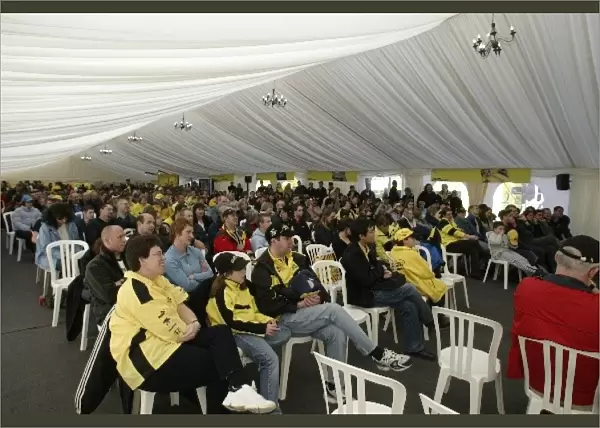Club Jordan Factory Open Day: Jordan fans listen to a live telephone interview with the drivers in the main marquee