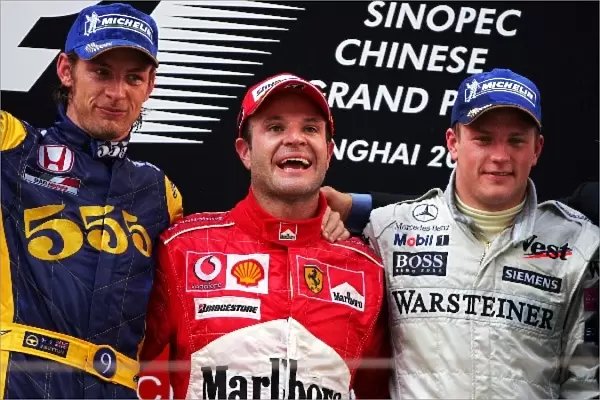 Formula One World Championship: L to R: Second place finisher Jenson Button BAR, race winner Rubens Barrichello Ferrari, and third place finisher