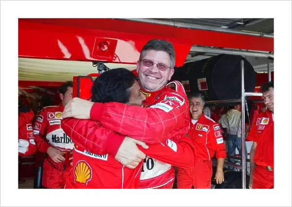 Formula One World Championship: Ross Brawn Ferrari Technical Director celebrates with Balbir Singh