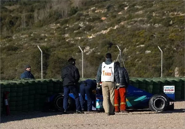 Formula One World Championship: The Sauber C21 of Felipe Massa is towed away following a big accident possibly caused by the front wing flexing