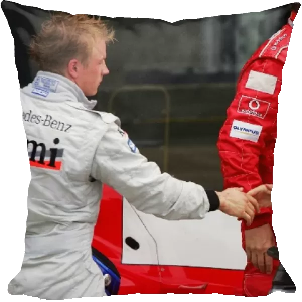 Formula One World Championship: second placed Kimi Raikkonen McLaren congratulates Rubens Barrichello Ferrari