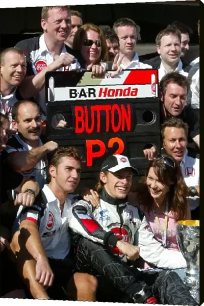 Formula One World Championship: Second placed Jenson Button BAR celebrates with the BAR team