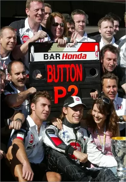 Formula One World Championship: Second placed Jenson Button BAR celebrates with the BAR team