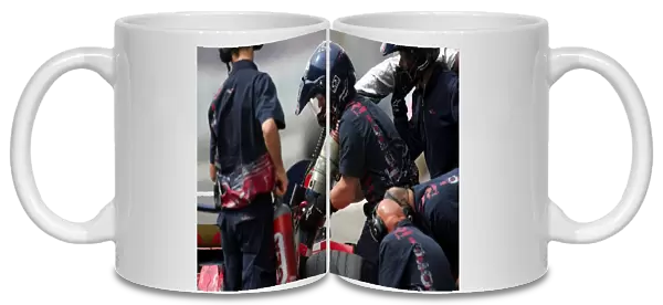 Formula One World Championship: Toro Rosso mechanics practice with the fuel rig