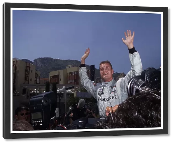 2001 Monaco Grand Prix - Qualifying. Monte Carlo, Monaco. 28th May 2001. David Coulthard, West McLaren Mercedes MP4  /  16, celebrates his pole position. World Copyright: Steve Etherington  /  LAT Photographic ref: 8 mb Digital Image