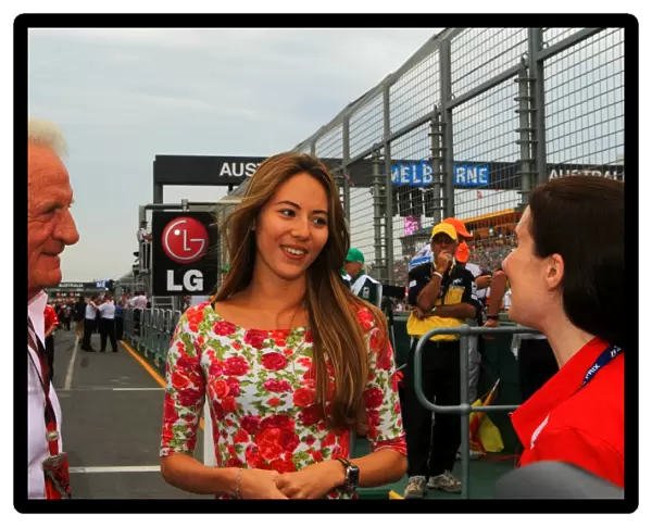 Formula One World Championship: Jessica Michibata with John Button on the grid