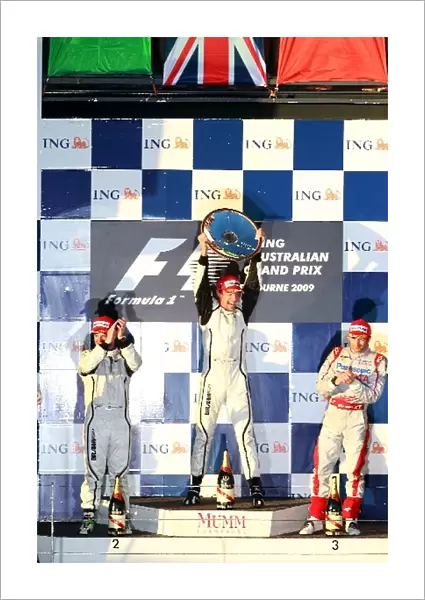 Formula One World Championship: The podium: Rubens Barrichello Brawn Grand Prix, second; Jenson Button Brawn Grand Prix, race winner; Jarno Trulli Toyota