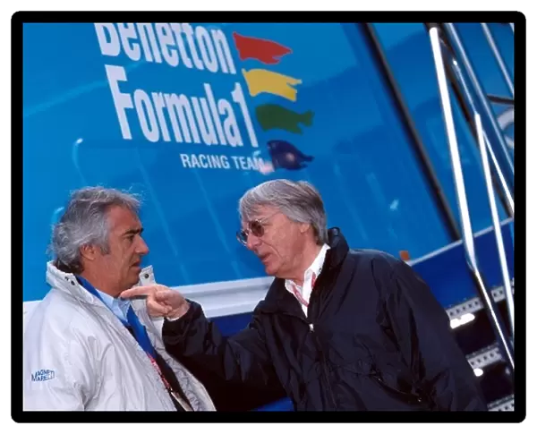 Formula One World Championship: Flavio Briatore Benetton F1 Boss in discussion with Bernie Ecclestone F1 Supremo