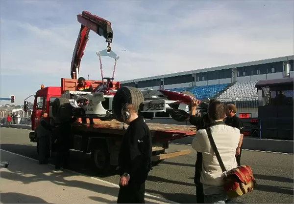Formula One Testing: Giancarlo Fisichellas Force India car is brought back to the pits after he spun