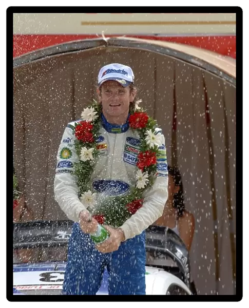 FIA World Rally Championship: Marcus Gronholm, Ford, sprays the winners champagne on the podium in Kemer