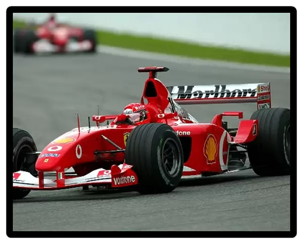 Formula One World Championship: Record breaking ten time race winner Michael Schumacher Ferrari F2002