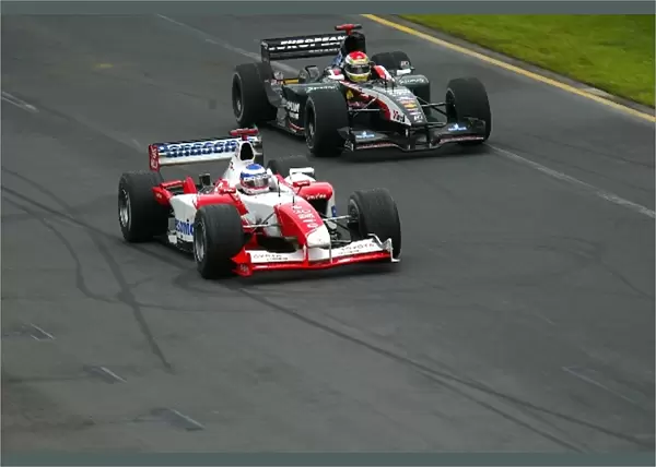 Formula One World Championship: Race retiree Olivier Panis Toyota TF103 overtakes GP debutante Justin Wilson Minardi Cosworth PS03