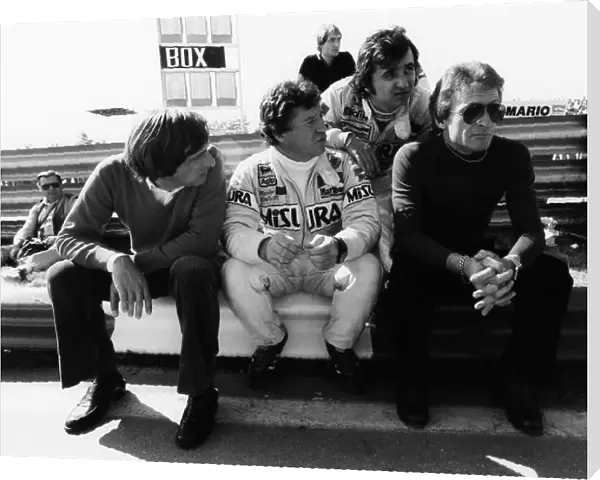 1981 Formula One World Championship. Bruno Giacomelli, Mario Andretti and Gerard Ducarouge sit in the pit lane, portrait. World Copyright: LAT Photographic. Ref: B / W Print