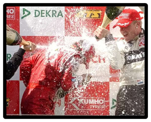 Podium, a bit too much champaign for race winner Markus Winkelhock (GER), M